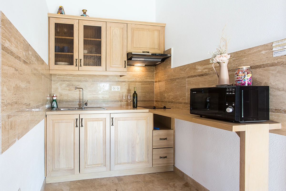 Second kitchen in the house, in white.